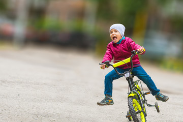 boy on bike with blurred background