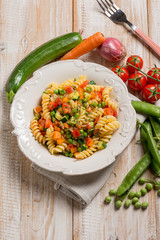 pasta with green peas zucchinis fresh tomatoes and carrot