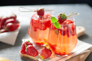 Red strawberry juice with fresh berries