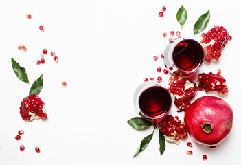 Fresh pomegranate juice in glass on white background, top view