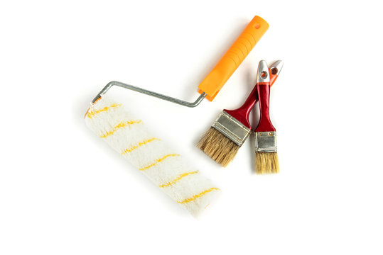 Paint brush and roller isolated on white background.