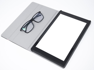 Tablet with blank screen isolated on a white surface and glasses laying on its side cover
