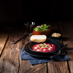 Carpaccio of beef with pine nuts, colorful pepper and Parmesan cheese