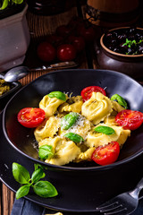 rustic spinach tortellini with cheese and cocktail cocktail tomatoes
