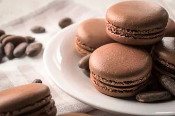 Foto op Canvas Tasty chocolate macarons on plate, closeup © Pixel-Shot