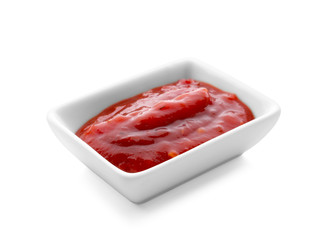 Bowl with delicious tomato sauce on white background