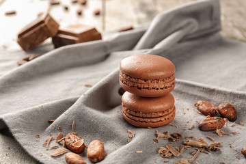 Delicious chocolate macarons on cloth