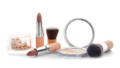 Composition with decorative cosmetics on white background