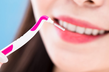woman take interdental brush