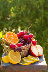juicy fresh fruit in the basket are on the table