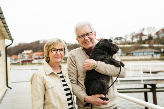 Portrait of senior couple with dog
