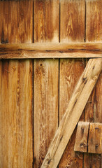 background, wooden door with transverse and space boards, visible nails