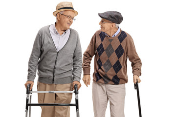Elderly man with walker and another man with cane walking