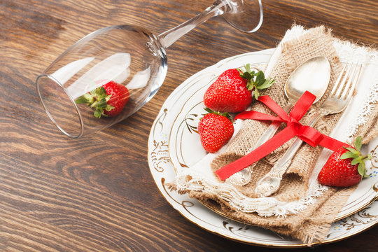 Tableware and silverware with strawberry