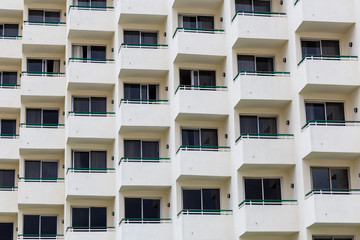 Architectural pattern of windows and balconies.
