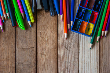 School accessories on a wooden background. Background for the text.
