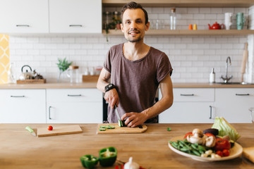 Picture of man cooking vegetables on table