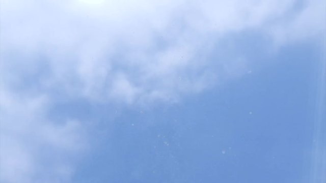 Time-lapse of clouds through bedroom window on a beautiful sunny day