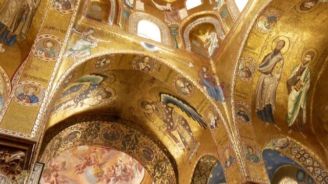 Christ in the dome beautiful Byzantine mosaics of the 12th century and the newer part is decorated with later frescoes the 18th century in the Martorana church.