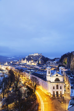 View over the old town, Markus Church and Hohensalzburg Castle at dusk, Salzburg, Austria