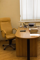 Office cabinet. Chair, table, documents.