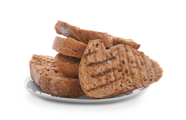 Plate with toasted bread on white background