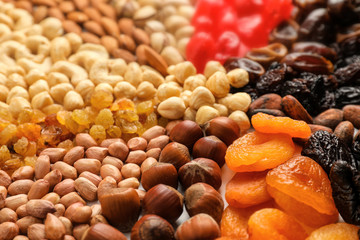 Different nuts, dried fruits and berries, closeup