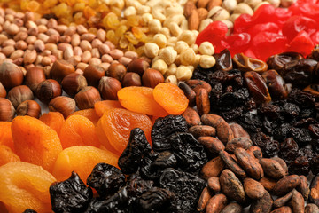Different nuts, dried fruits and berries, closeup