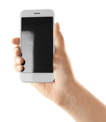 Young woman holding smartphone on white background
