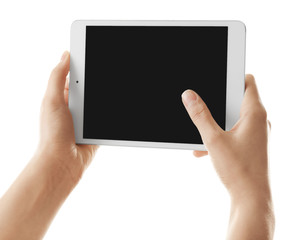 Young woman holding tablet computer on white background