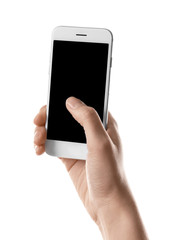 Young woman holding smartphone on white background