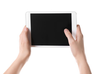 Young woman holding tablet computer on white background