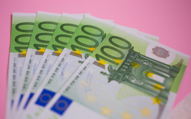 close up bundle of money Euros banknotes on the color background, business, finance, saving, banking concept