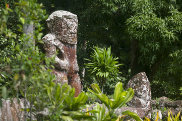 historic stone statues, so called Tikis, created by native inhabitants of Hiva Oa,  Marquesas...