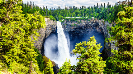 Large snow melt in the Cariboo Mountains creates spectacular water flow of Helmcken Falls on the Murtle River in Wells Gray Provincial Park near the town of Clearwater, British Columbia, Canada