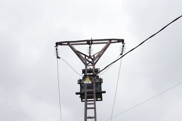 Old pylon with electric lines