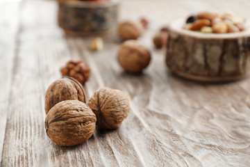 Tasty walnuts on wooden table