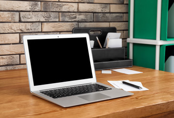 Fototapeta premium Stylish workplace with laptop on table