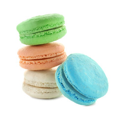 Tasty colorful macarons on white background