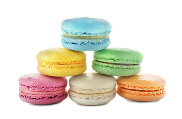 Tasty colorful macarons on white background