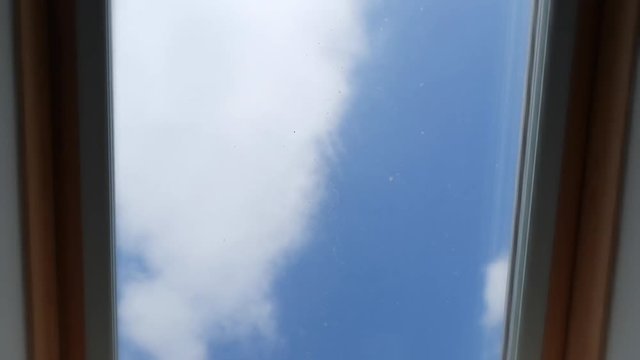 Time-lapse of clouds through bedroom window on a beautiful sunny day