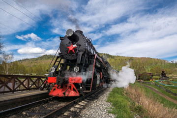 The old locomotive produces steam