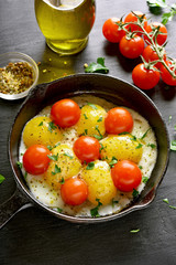 Fried eggs with tomatoes