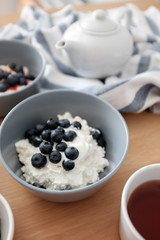 Healthy breakfast with cottage cheese and blueberries