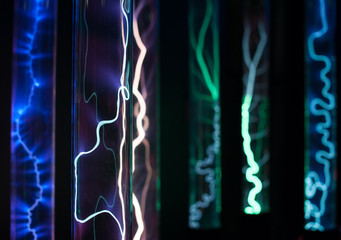 Plenty of plasma glass flasks of cylinders filled with intertidal gases, with a high voltage source