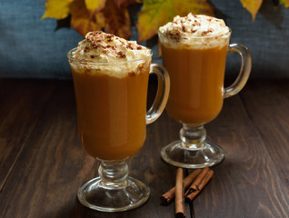 Pumpkin latte with whipped cream and cinnamon
