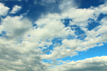Beautiful blue sky and white fluffy cumulus clouds. Background. Landscape.