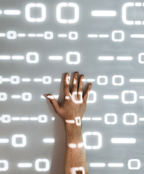 Hand of wall with futuristic light pattern