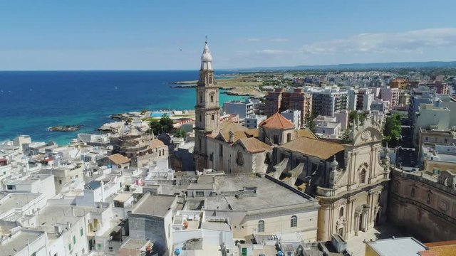 Old Church in Monopoly and blue sea coastline in Italy Drone flight 4k