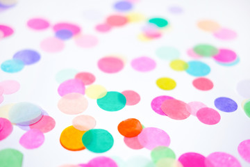 Close-up of colorful confetti on white background
